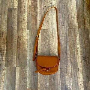 The Ivy Crossbody is genuine leather.
